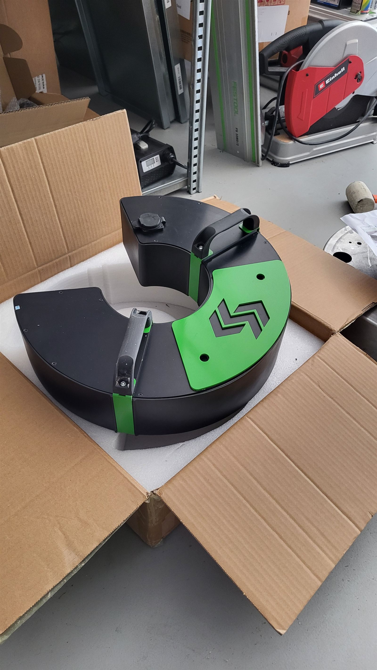 Two halves of the Kiwi horseshoe battery pack housing