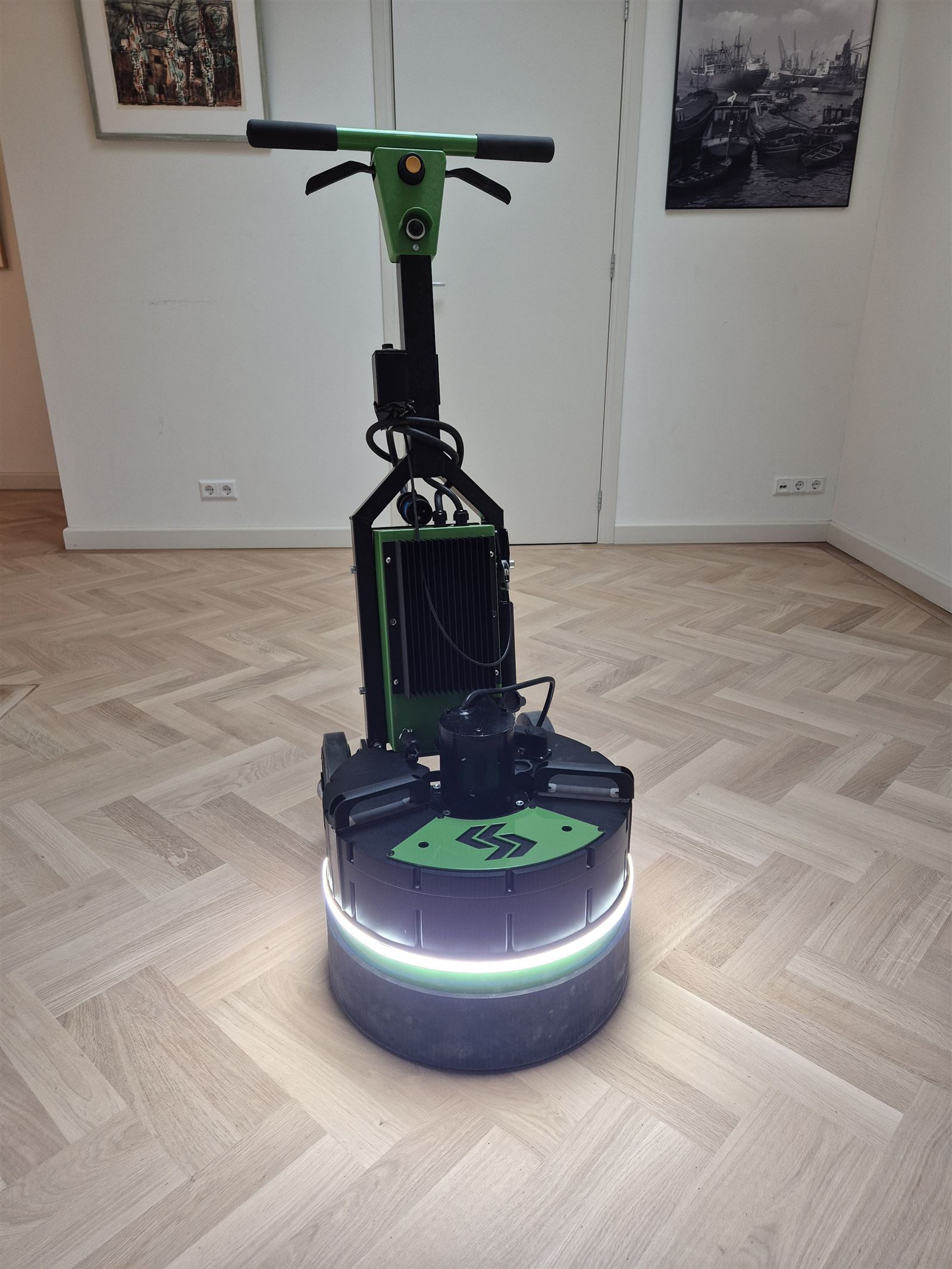 Kiwi cordless floor machine on herringbone parquet
